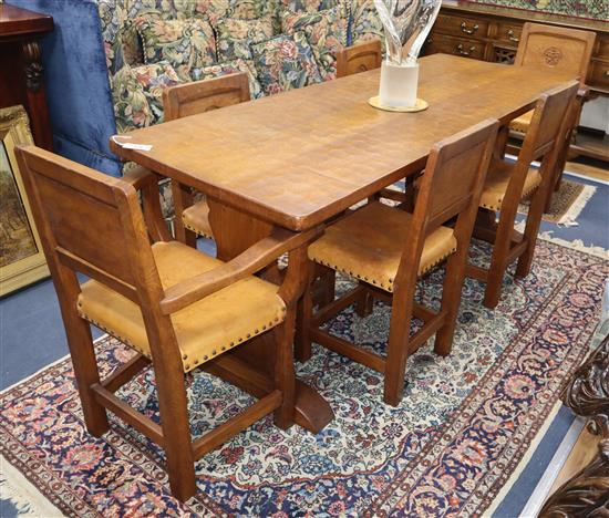 Thomas Gnomeman Whittaker of Littlebeck, a rectangular adzed oak dining table and six chairs (2 with arms) table length 183cm